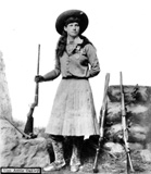 Annie Oakley holding a gun